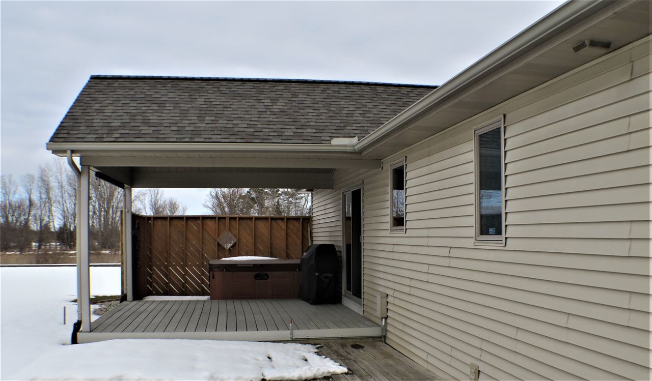 1420 South Morrish Road Flint, MI 48532 - Photo 23 of 32 Covered deck with pull down sunscreen and convenient natural gas hook-up for your grill....no need to get propane tanks filled!