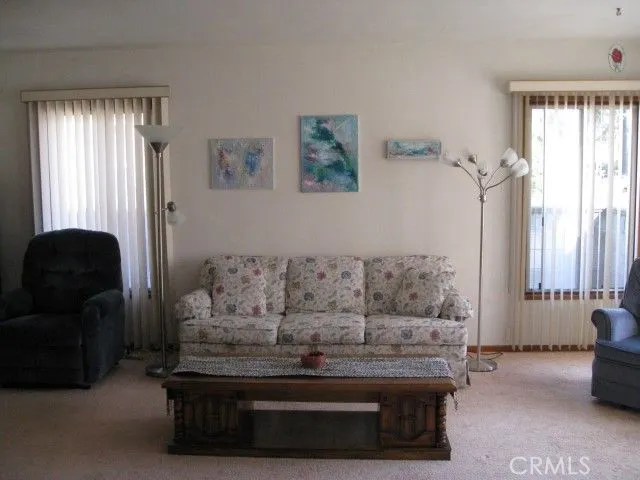 a living room with furniture and window