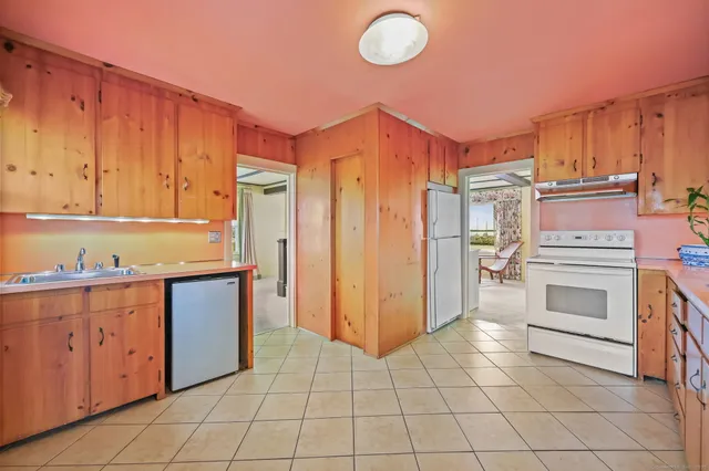 a kitchen with cabinets and appliances