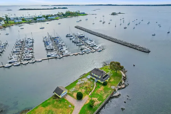 an aerial view of a house with a lake view