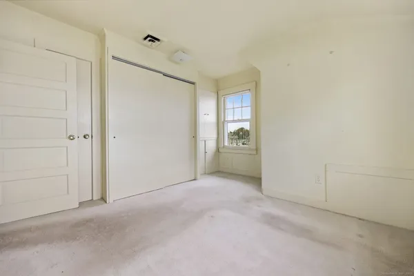 a view of a room with a hallway