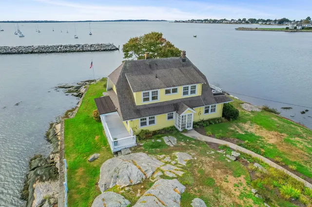 a aerial view of a house with a lake view