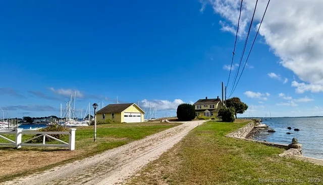 a view of a backyard with table and chairs