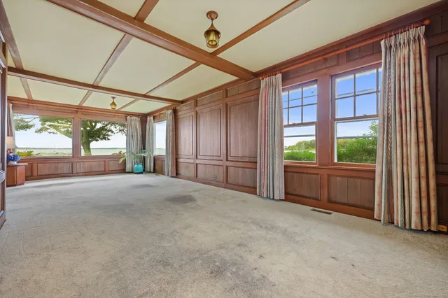 a view of an empty room with a balcony