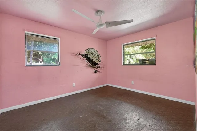 a view of room with hardwood floor and window