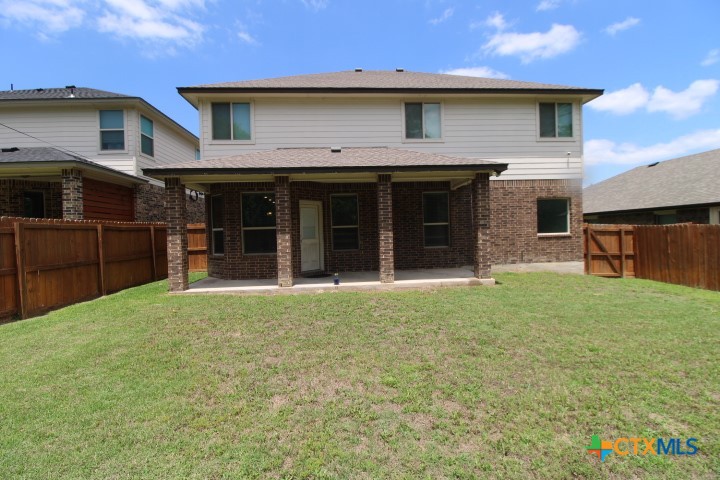 1202 Stonewall Ridge Harker Heights, TX 76548 - Photo 14 of 14 a front view of a house with a garden