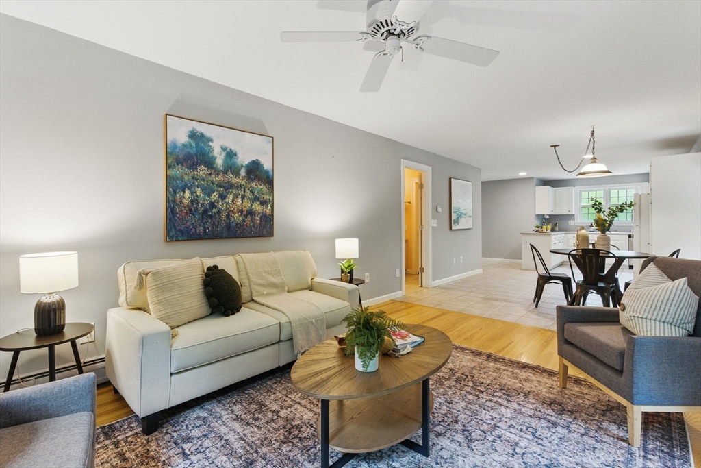 50 Claybrook Road Sunderland, MA 01375 - Photo 1 of 18 a living room with furniture and a chandelier