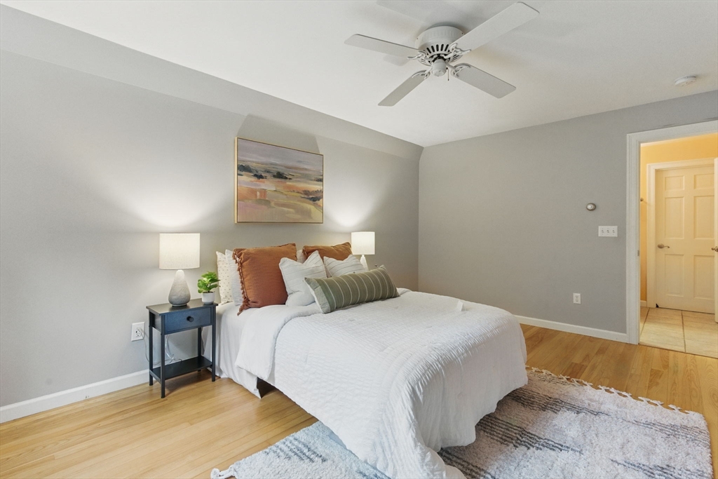 50 Claybrook Road Sunderland, MA 01375 - Photo 12 of 18 a bedroom with a bed and a chandelier