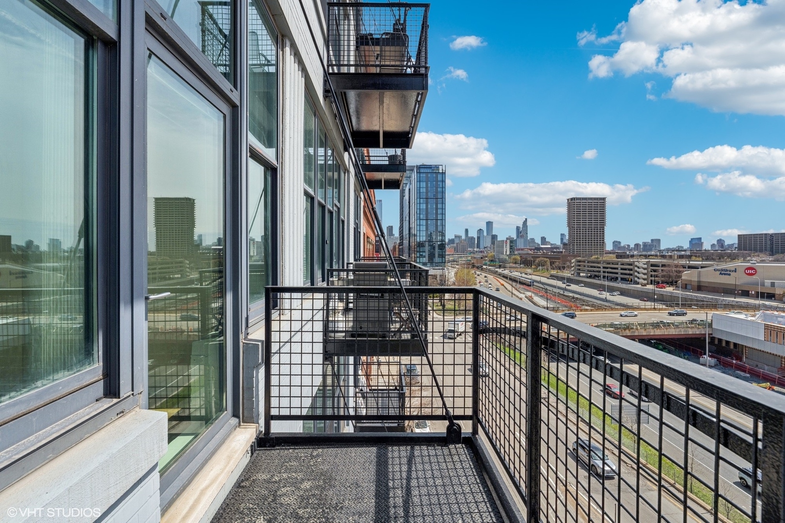 1224 West Van Buren Street, Unit 502 Chicago, IL 60607 - Photo 3 of 3 a view of a balcony with floor to ceiling windows
