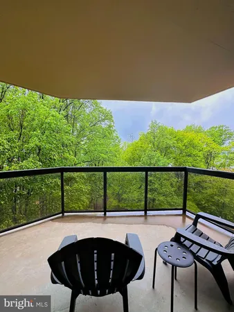 a view of swimming pool from a balcony