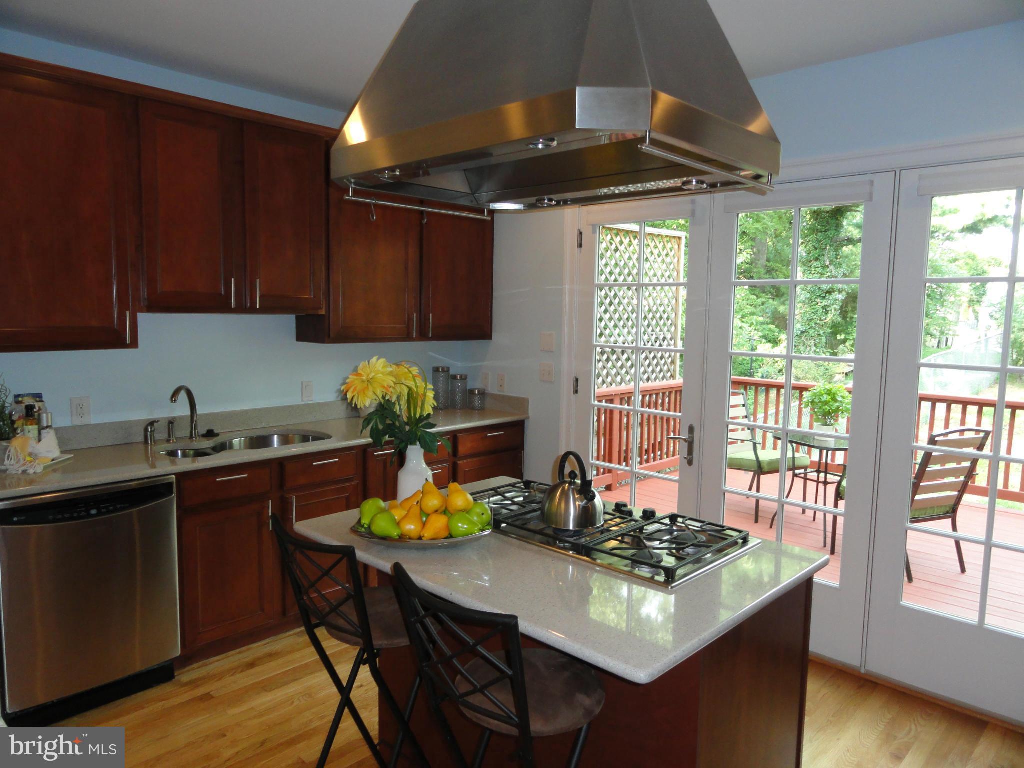 2443 Tunlaw Road Northwest Washington, DC 20007 - Photo 11 of 30 Kitchen w/ island stove top and bar