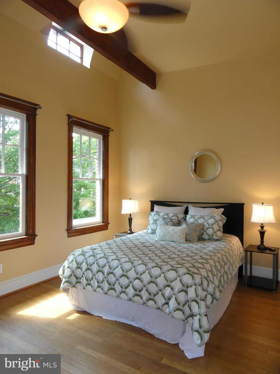 2443 Tunlaw Road Northwest Washington, DC 20007 - Photo 22 of 30 Vaulted ceiling, exposed beam, attic windows