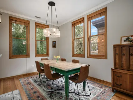 a view of a dining room with furniture window and outside view