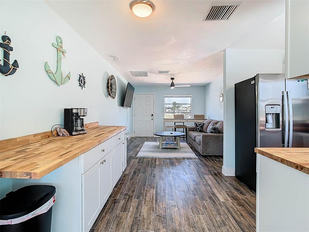 4984 Cedarbrook Lane Hernando Beach, FL 34607 - Photo 22 of 65 a kitchen with a sink appliances and wooden floor