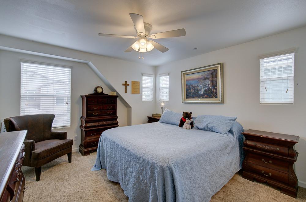 1530 Nabors Drive Clovis, CA 93619 - Photo 13 of 27 a bedroom with bed and window