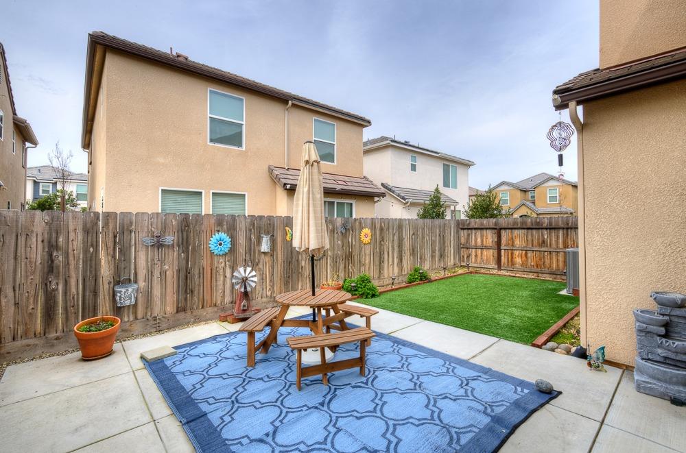 1530 Nabors Drive Clovis, CA 93619 - Photo 20 of 27 a backyard of a house with table and chairs