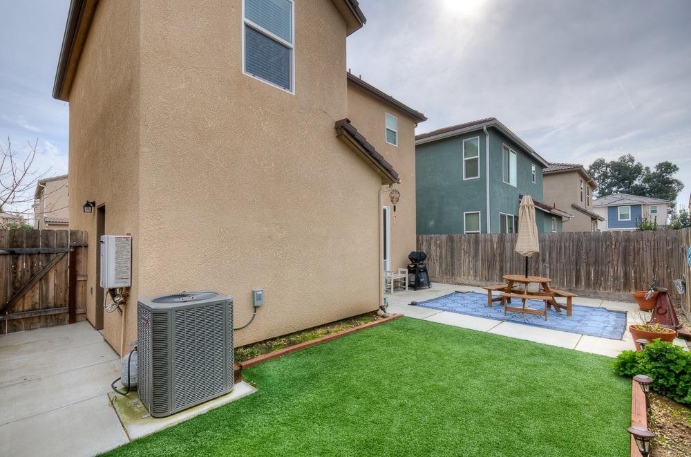 1530 Nabors Drive Clovis, CA 93619 - Photo 22 of 27 a view of a patio with a table and chairs