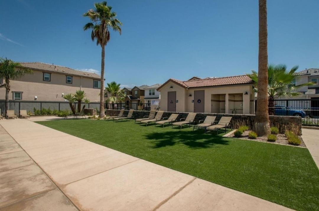 1530 Nabors Drive Clovis, CA 93619 - Photo 25 of 27 a front view of a house with a garden and yard