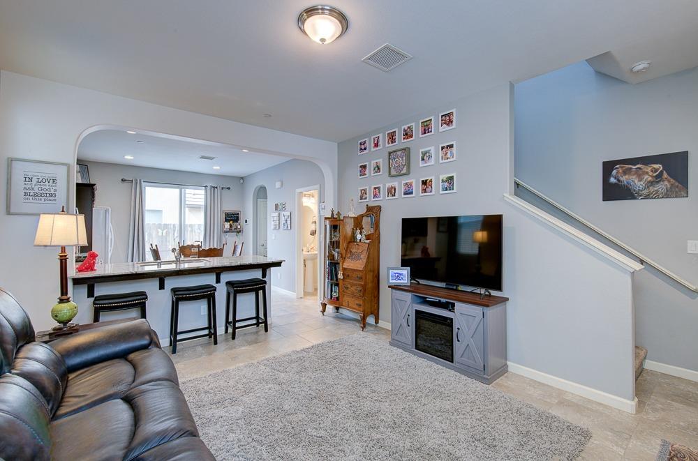 1530 Nabors Drive Clovis, CA 93619 - Photo 4 of 27 a living room with furniture and a flat screen tv