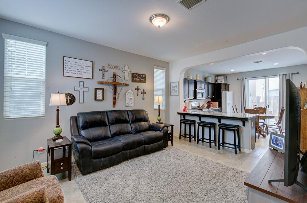 1530 Nabors Drive Clovis, CA 93619 - Photo 5 of 27 a living room with furniture and a dining table with kitchen view