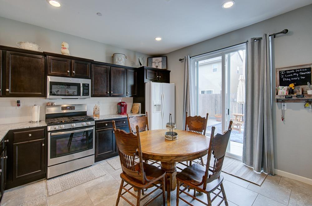 1530 Nabors Drive Clovis, CA 93619 - Photo 9 of 27 a view of a dining room with furniture and wooden floor