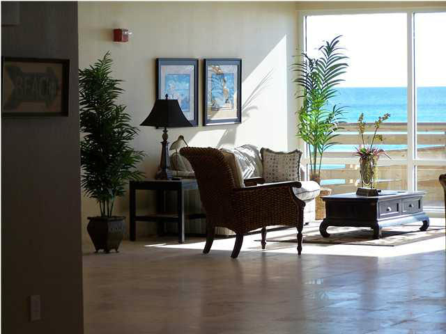16819 Front Beach Road, Unit 1613 Panama City Beach, FL 32413 - Photo 7 of 8 a living room with furniture and a large window