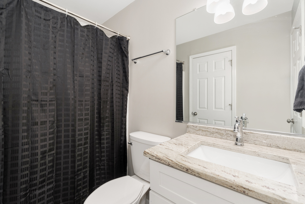 24849 Vermette Road Plainfield, IL 60585 - Photo 9 of 16 a bathroom with a granite countertop sink toilet and shower