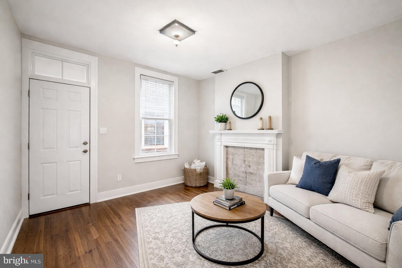 2535 Boyd Street Baltimore, MD 21223 - Photo 2 of 13 a living room with furniture and a fireplace