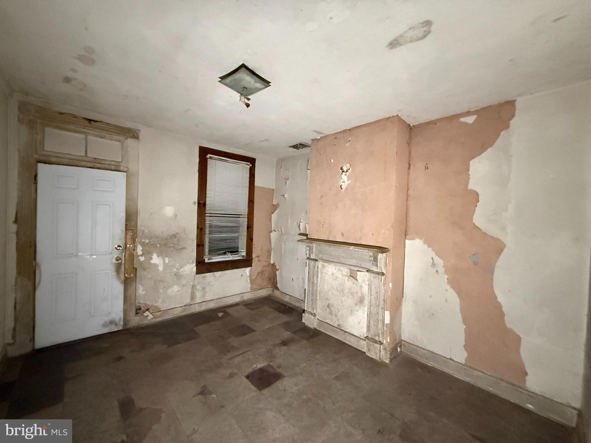 2535 Boyd Street Baltimore, MD 21223 - Photo 3 of 13 an empty room with windows