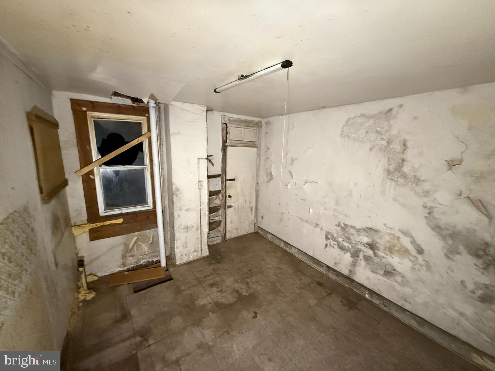 2535 Boyd Street Baltimore, MD 21223 - Photo 6 of 13 a view of room with window and refrigerator