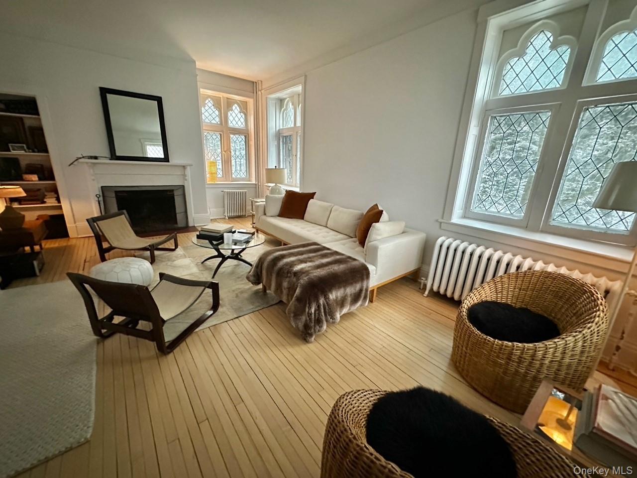 61 Crows Nest Road, Unit 5 Tuxedo Park, NY 10987 - Photo 16 of 16 a bedroom with furniture and a wooden floor