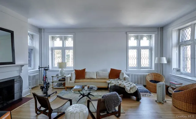 a living room with furniture and fireplace