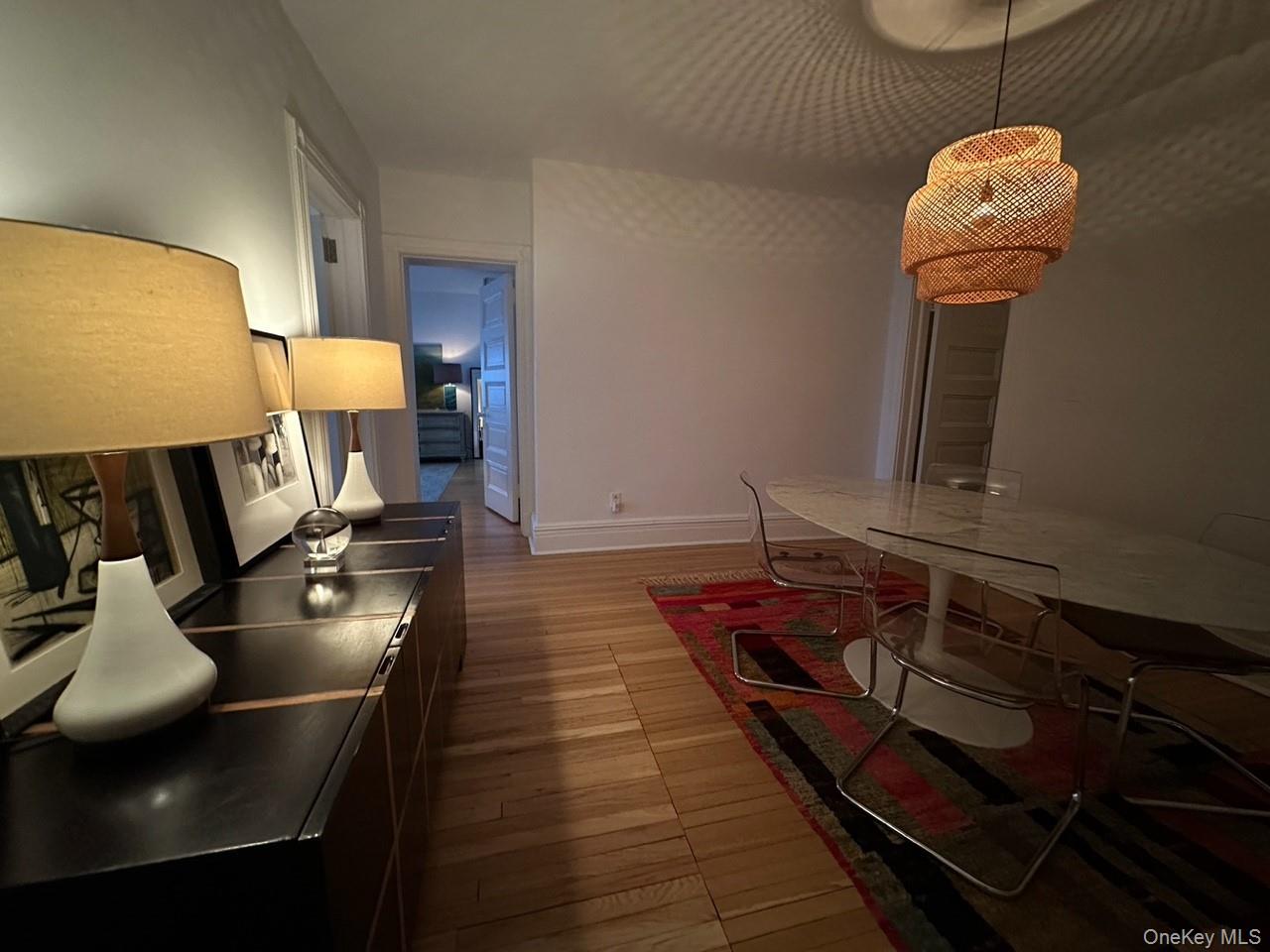 61 Crows Nest Road, Unit 5 Tuxedo Park, NY 10987 - Photo 6 of 16 a living room with furniture and a flat screen tv