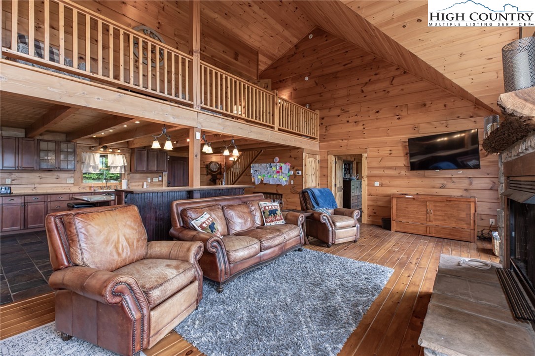 595 Little Squirrel Creek Road Newland, NC 28657 - Photo 14 of 49 a living room with furniture and a flat screen tv