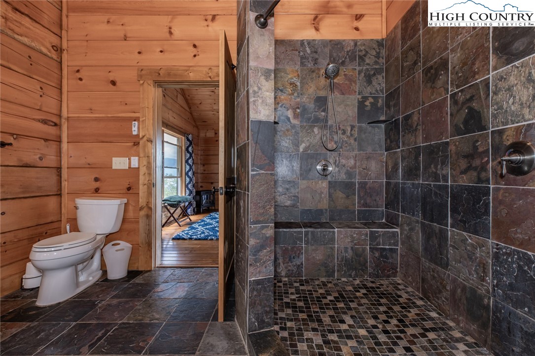 595 Little Squirrel Creek Road Newland, NC 28657 - Photo 20 of 49 a bathroom with a toilet and a shower