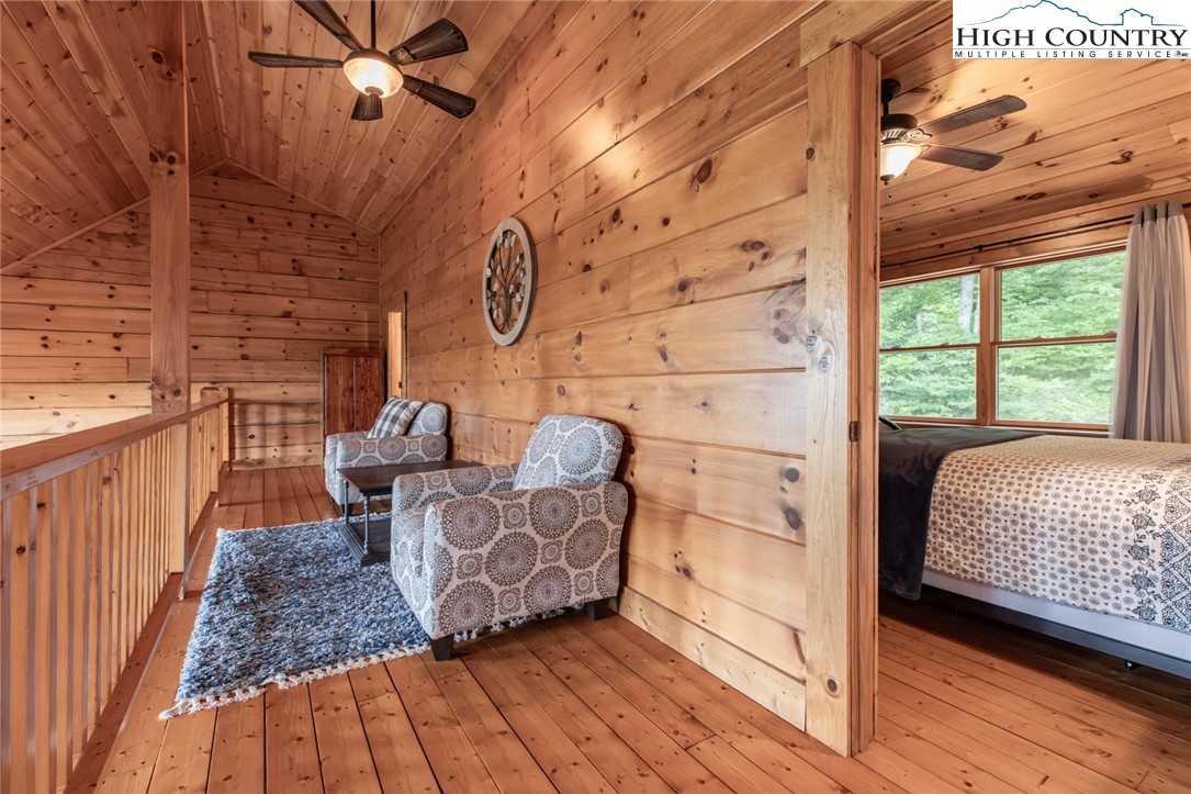 595 Little Squirrel Creek Road Newland, NC 28657 - Photo 21 of 49 a bed room with a bed and a window