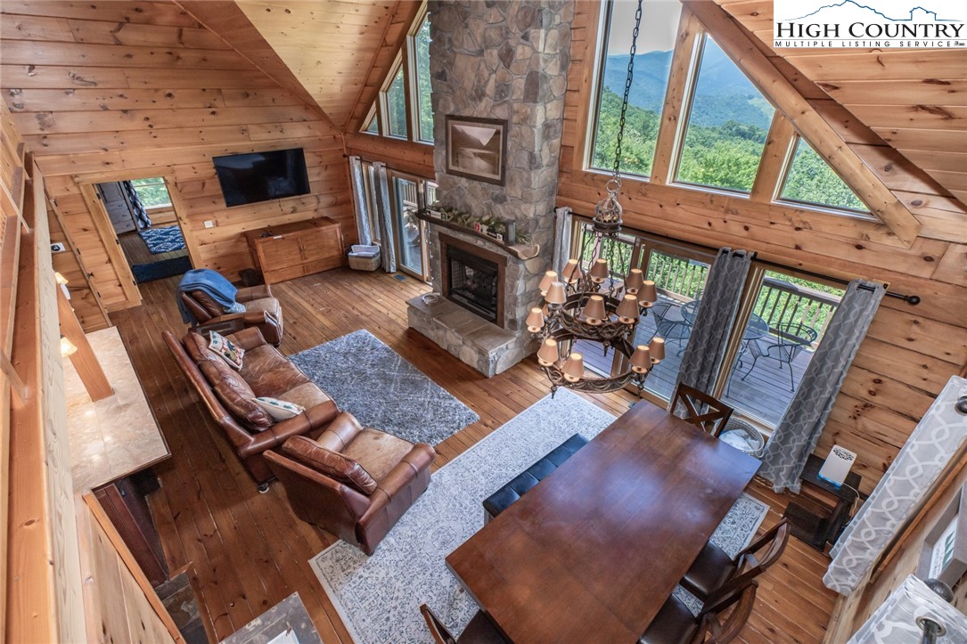 595 Little Squirrel Creek Road Newland, NC 28657 - Photo 26 of 49 a living room with furniture fireplace and a flat screen tv
