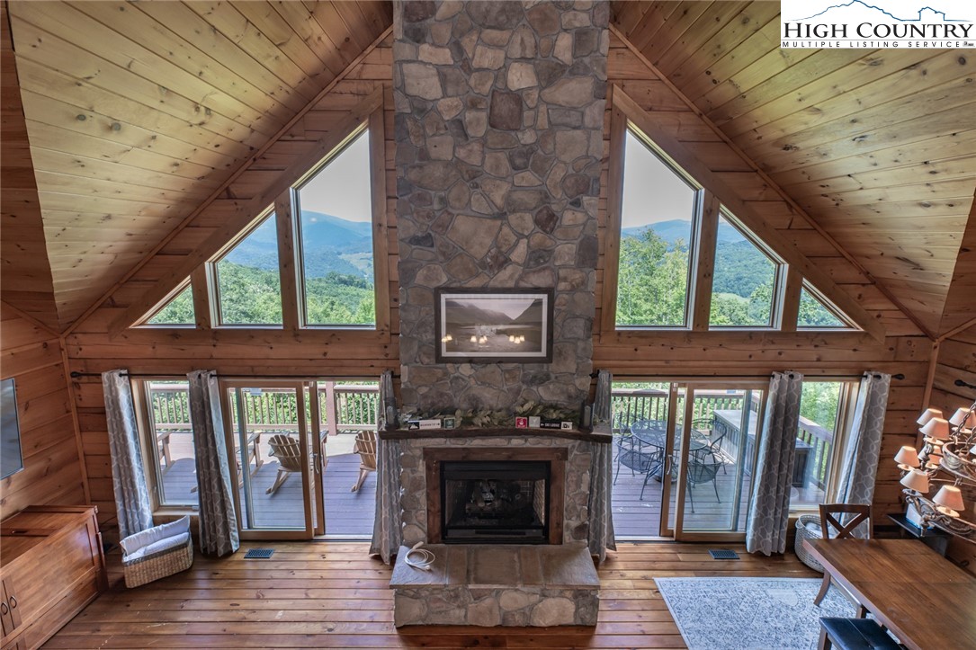 595 Little Squirrel Creek Road Newland, NC 28657 - Photo 27 of 49 a living room with furniture and a fireplace