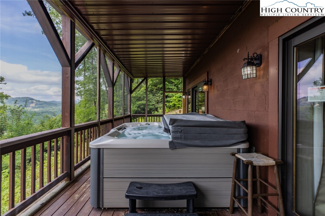 595 Little Squirrel Creek Road Newland, NC 28657 - Photo 42 of 49 a view of a balcony with furniture