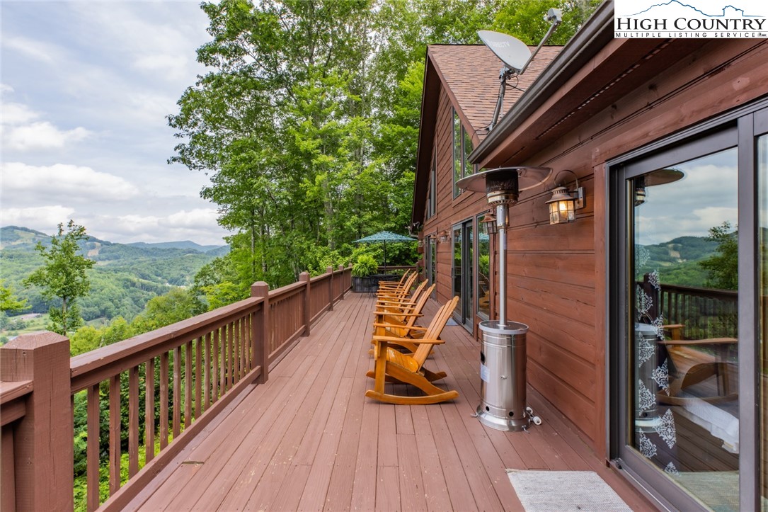 595 Little Squirrel Creek Road Newland, NC 28657 - Photo 45 of 49 a view of balcony with couch and wooden floor