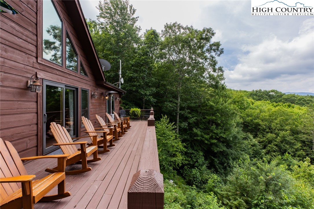 595 Little Squirrel Creek Road Newland, NC 28657 - Photo 46 of 49 a view of house with patio outdoor seating