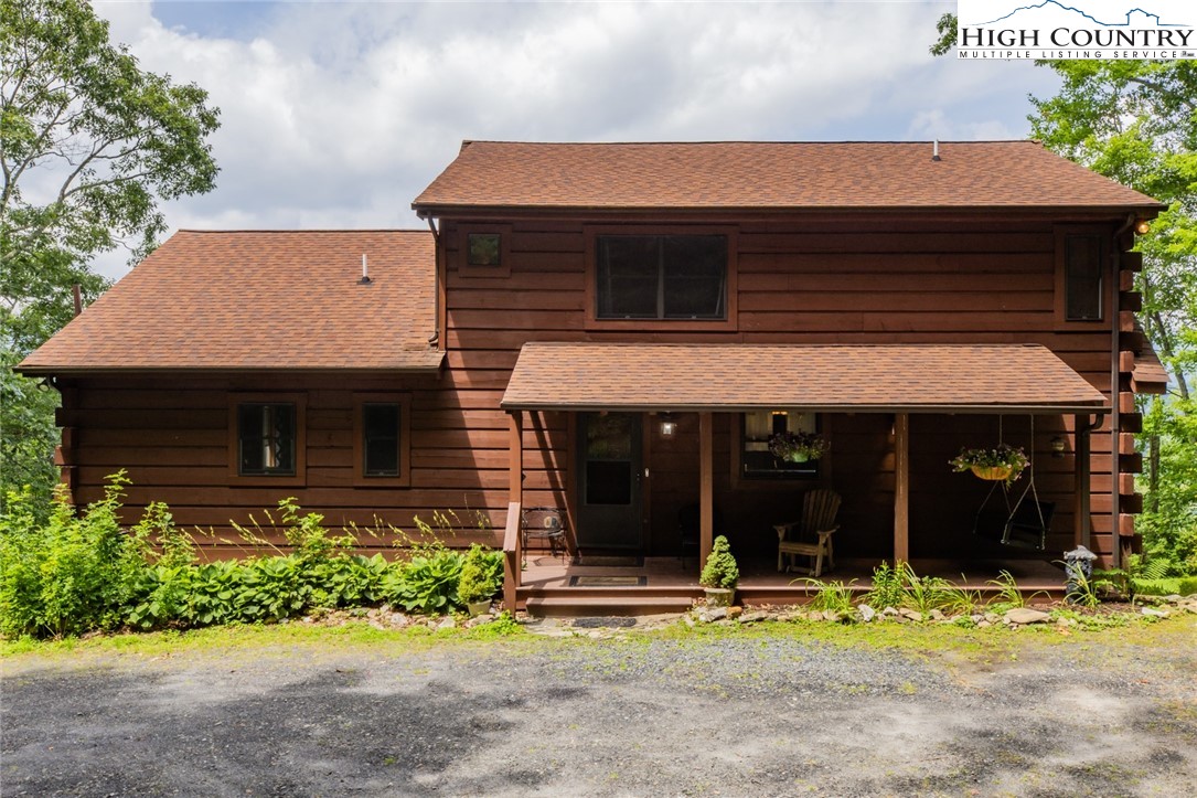 595 Little Squirrel Creek Road Newland, NC 28657 - Photo 48 of 49 a front view of a house with garden