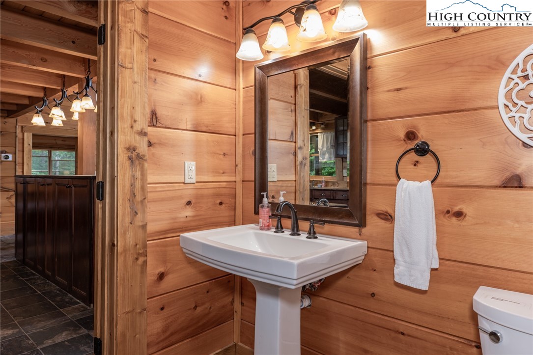 595 Little Squirrel Creek Road Newland, NC 28657 - Photo 10 of 49 a bathroom with a sink and a mirror