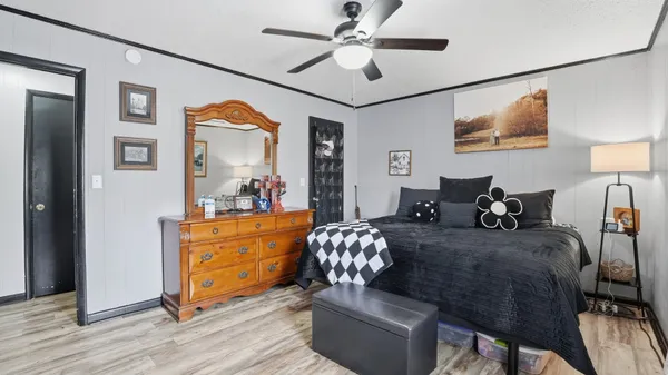 a bedroom with a bed and furniture