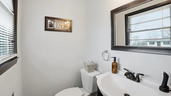 a bathroom with a sink vanity and mirror