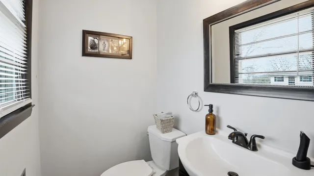 a bathroom with a sink vanity and mirror