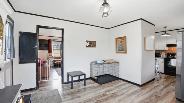 a view of a livingroom with furniture and wooden floor