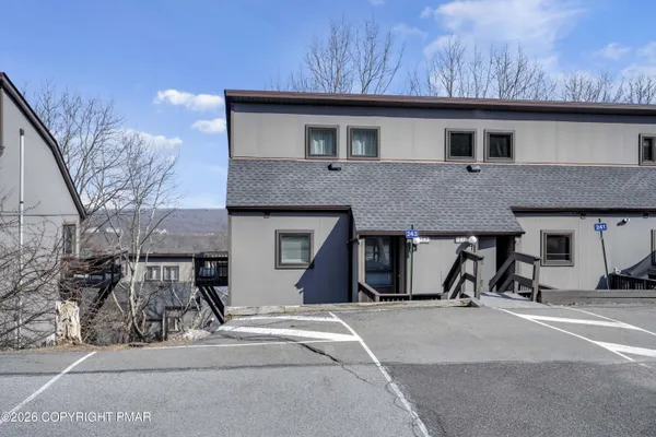a front view of a house with parking