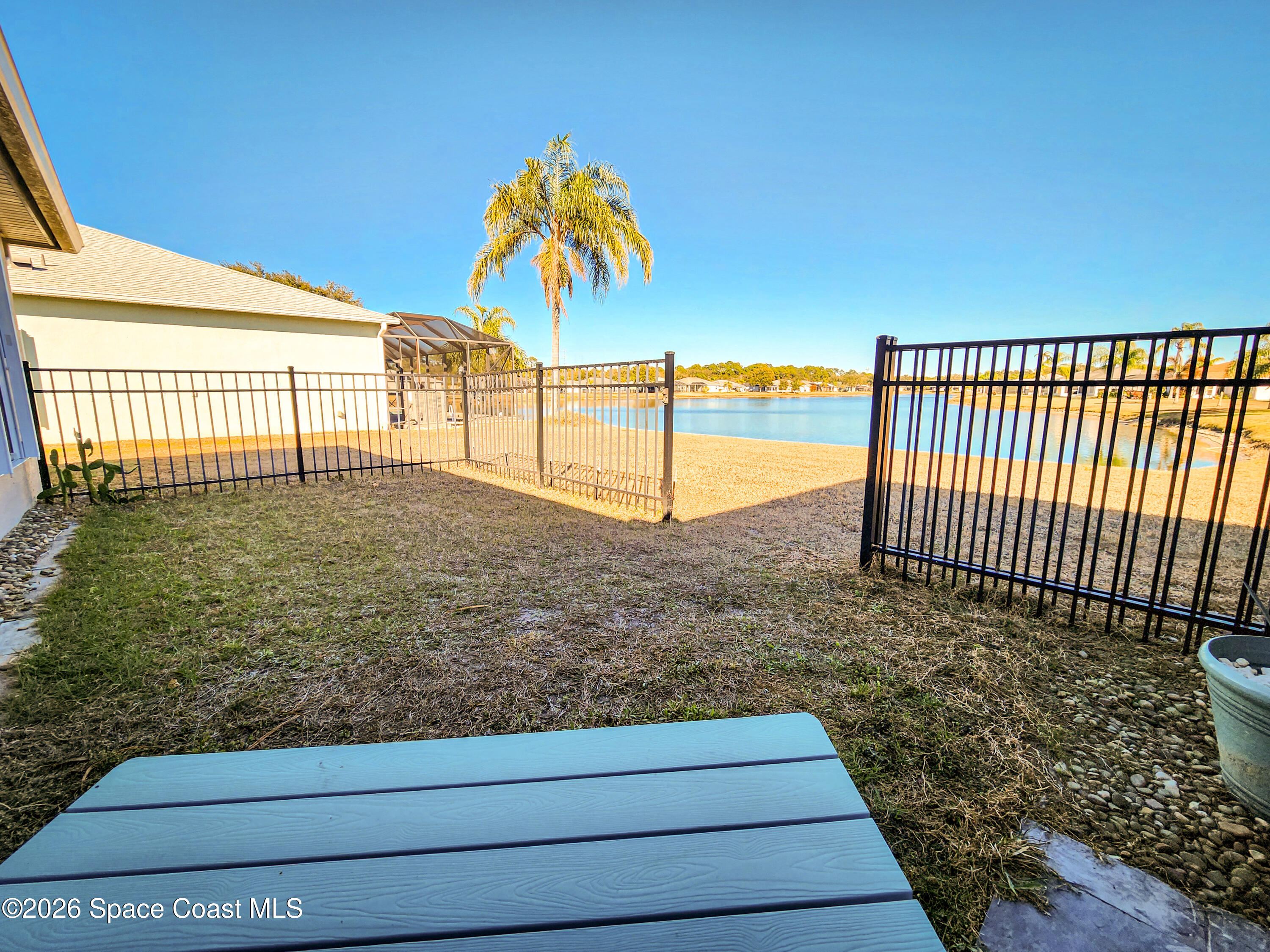 7419 Hackberry Road Cocoa, FL 32927 - Photo 22 of 27 Backyard lake view