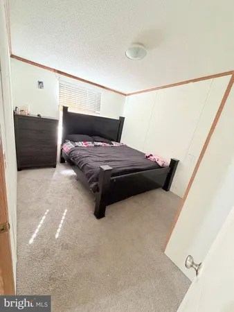 a hotel room with a bed and large window